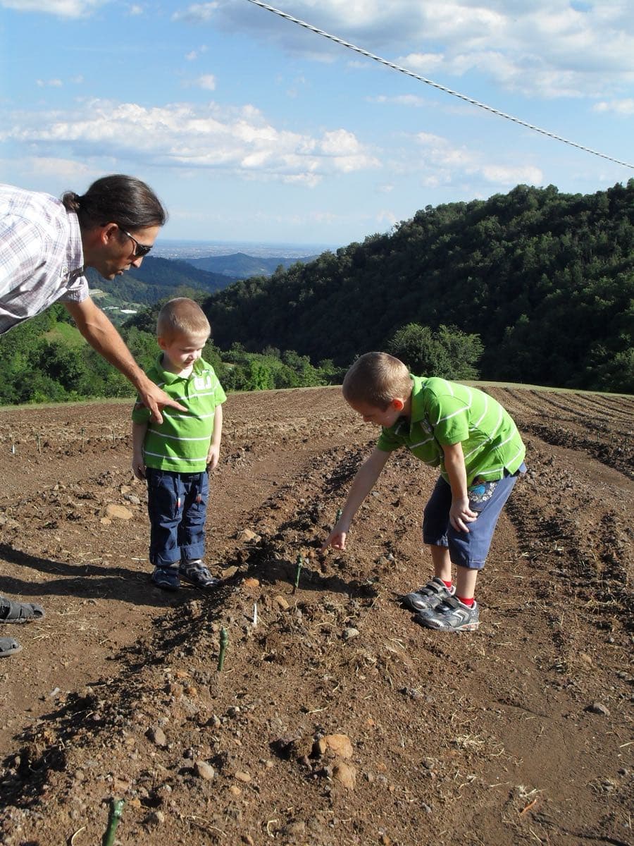 Matteo Pontalto with his children in a newly planted vineyard